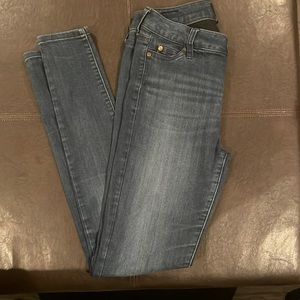 Slightly used, sketchy and comfortable blue jeans for juniors.